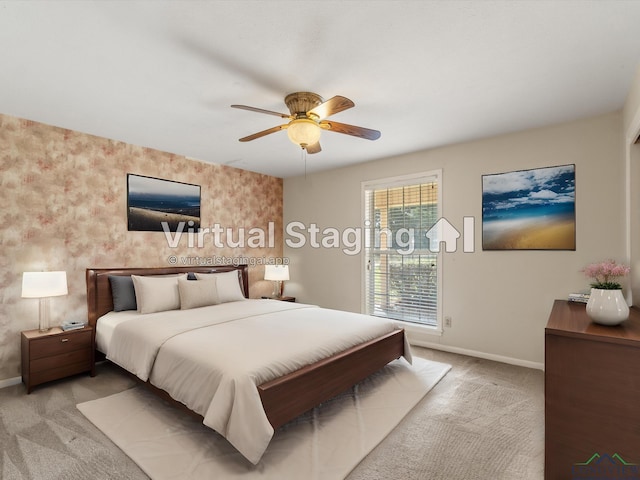 bedroom with light colored carpet and ceiling fan