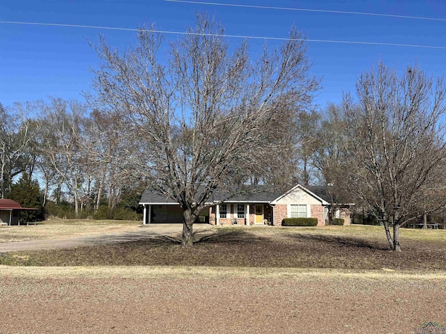 ranch-style home with a carport