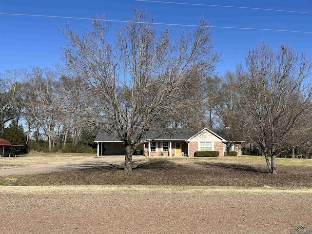 view of front of home with a carport