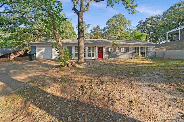 ranch-style house with a front lawn and a garage