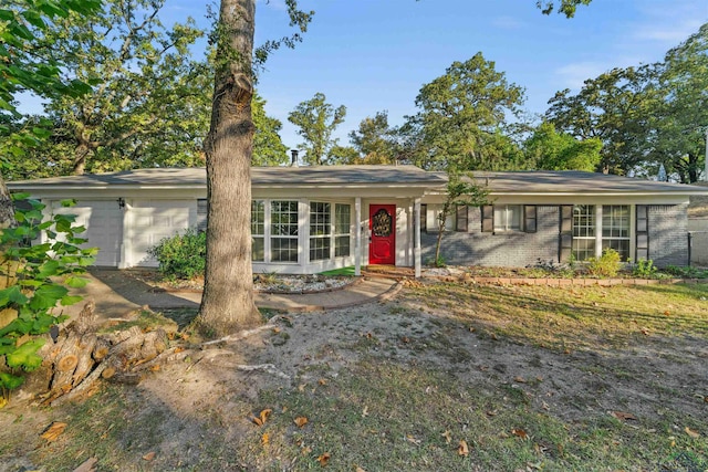 ranch-style home featuring a garage