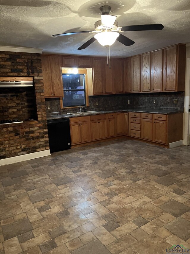 kitchen featuring tasteful backsplash, black dishwasher, sink, and a textured ceiling