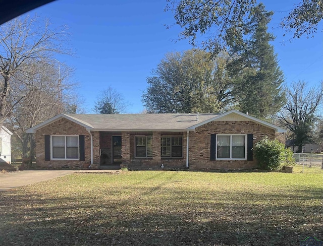 ranch-style house with a front lawn