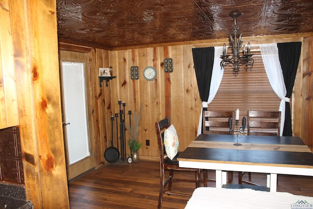 dining room featuring wood walls and dark wood-type flooring