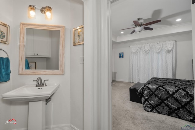 bedroom with light carpet, crown molding, and ceiling fan