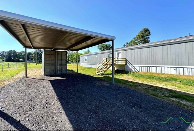 view of vehicle parking with a carport