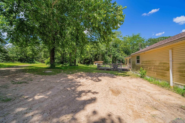 8123 Cherokee Trce, Gilmer, TX 75644 - view of yard featuring a wooden deck