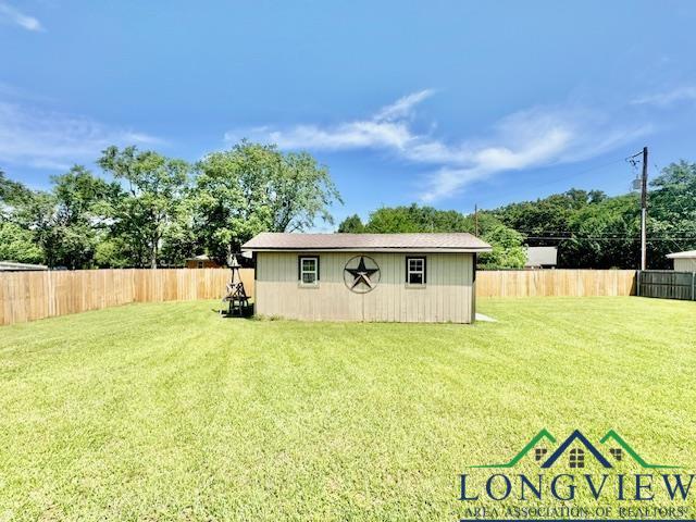 view of outbuilding featuring an outdoor structure and a fenced backyard