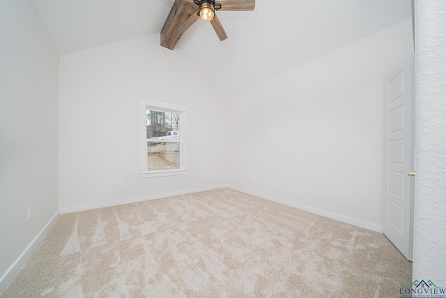 carpeted empty room featuring vaulted ceiling with beams and ceiling fan