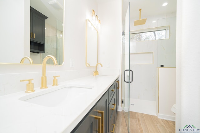 bathroom with vanity and an enclosed shower