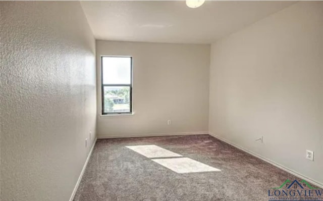 unfurnished room featuring carpet flooring