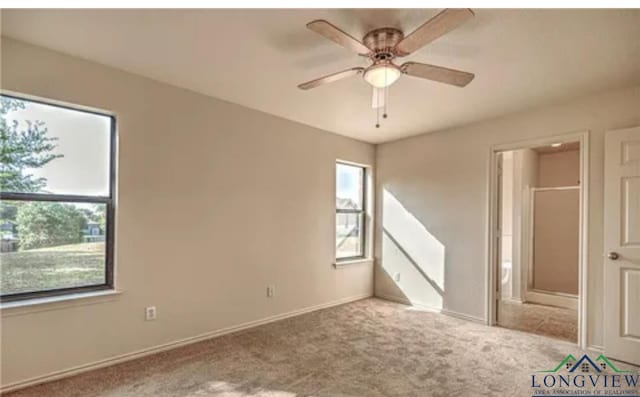 unfurnished room with ceiling fan and light colored carpet