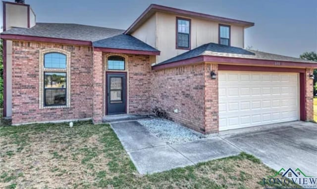 view of front of property featuring a garage