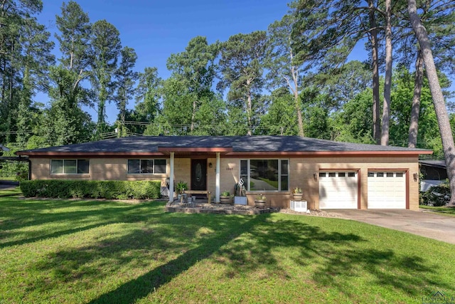 1907 Mary Jane Dr, Longview, TX 75601 - ranch-style house with an attached garage, concrete driveway, and a front yard