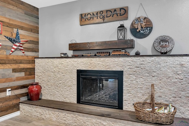 1907 Mary Jane Dr, Longview, TX 75601 - detailed view of wooden walls, a glass covered fireplace, and wood finished floors