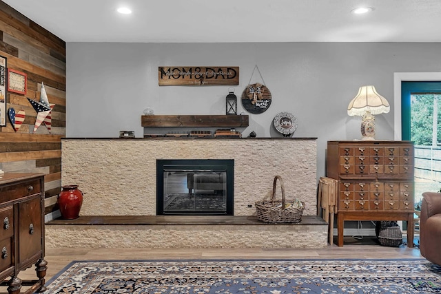 1907 Mary Jane Dr, Longview, TX 75601 - living area featuring wood finished floors, recessed lighting, wooden walls, and a glass covered fireplace