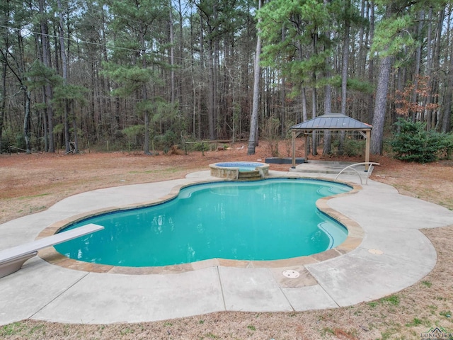 view of pool featuring a gazebo, an in ground hot tub, and a patio