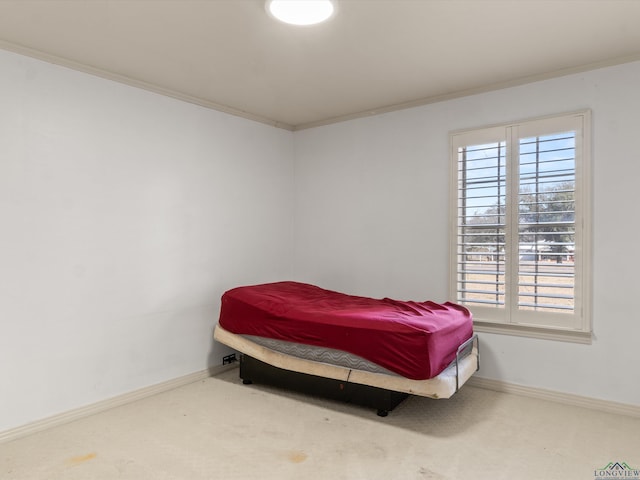 bedroom with multiple windows, ornamental molding, and carpet flooring