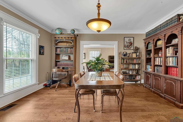 office featuring crown molding and light hardwood / wood-style flooring