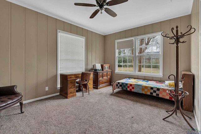 interior space featuring ornamental molding, carpet, and ceiling fan