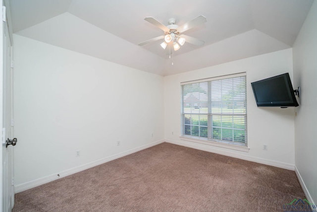 carpeted empty room with baseboards and a ceiling fan