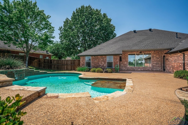 view of pool with a fenced in pool, a fenced backyard, and a patio area