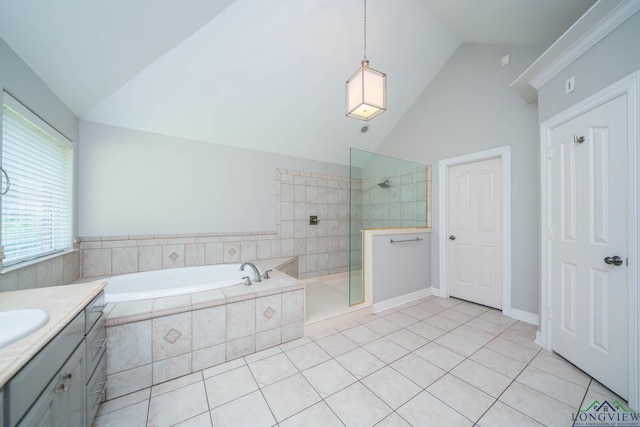 full bath featuring a garden tub, tile patterned flooring, walk in shower, vaulted ceiling, and vanity