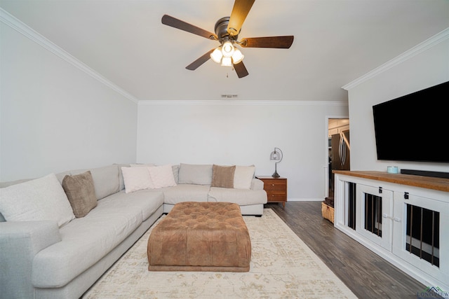 523 Molly Cir, Carthage, TX 75633 - living area with ornamental molding, dark wood finished floors, and ceiling fan