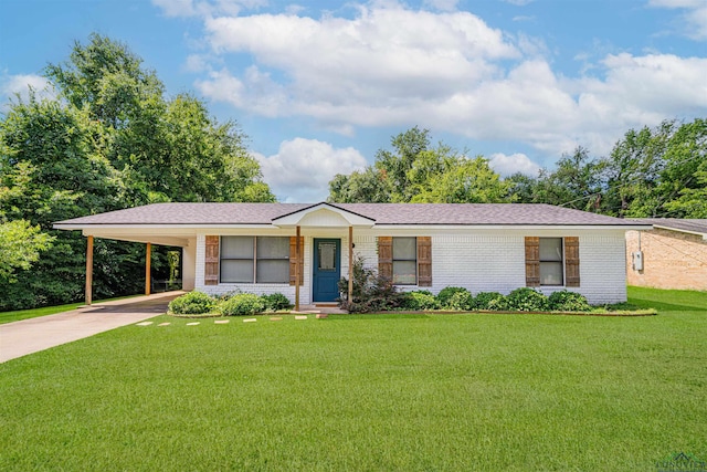 523 Molly Cir, Carthage, TX 75633 - ranch-style house with brick siding, concrete driveway, a front yard, and an attached carport