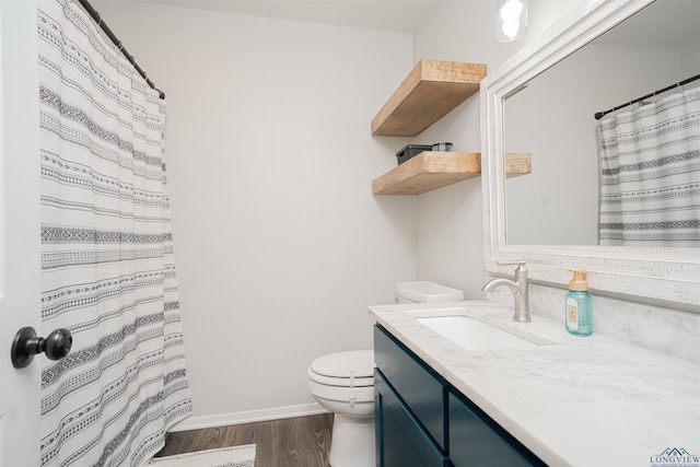 523 Molly Cir, Carthage, TX 75633 - full bath with vanity, wood finished floors, and curtained shower