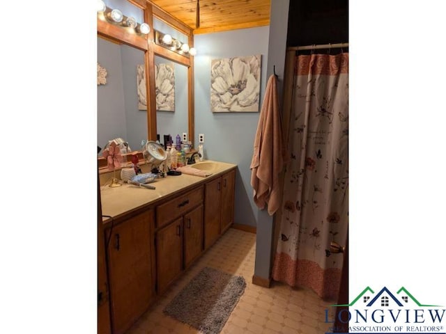 bathroom with walk in shower, vanity, and wooden ceiling