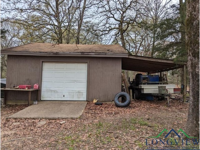 garage featuring a carport