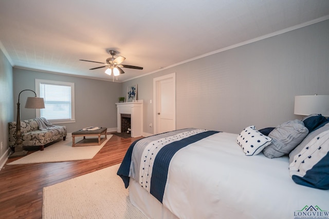 bedroom featuring ceiling fan, dark hardwood / wood-style flooring, and crown molding