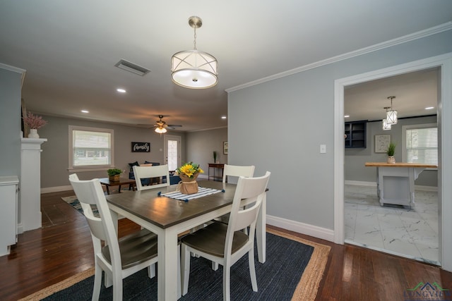 dining area with ceiling fan, hardwood / wood-style floors, and ornamental molding