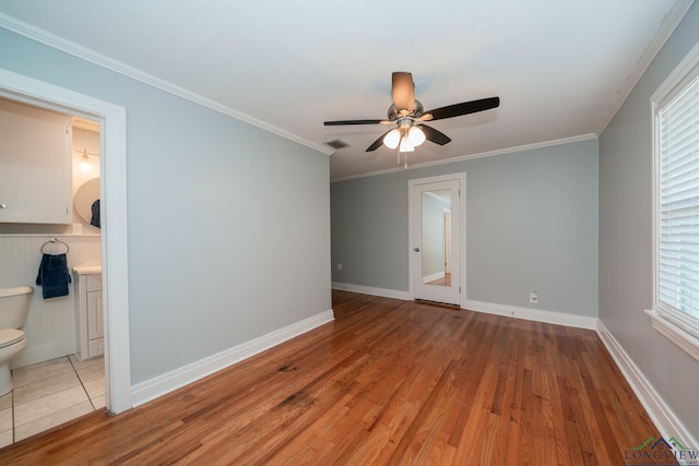 unfurnished room featuring ceiling fan, ornamental molding, and light hardwood / wood-style flooring