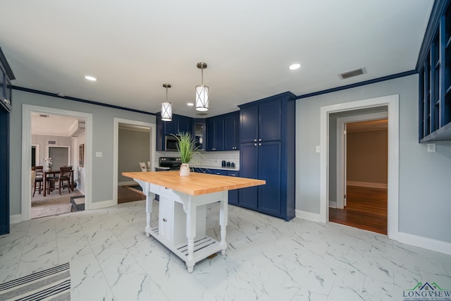 kitchen featuring blue cabinetry, pendant lighting, wooden counters, and ornamental molding