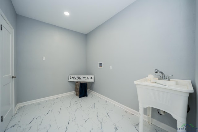 clothes washing area featuring washer hookup and sink