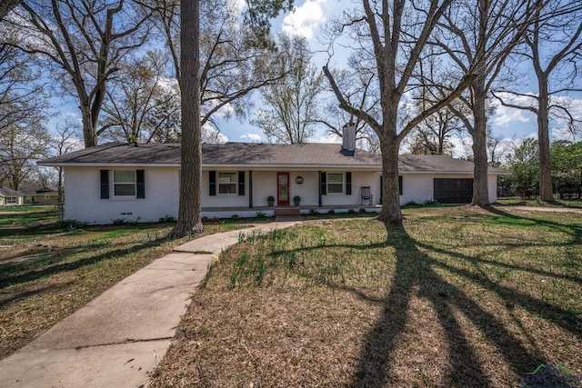 single story home with a front lawn and a garage