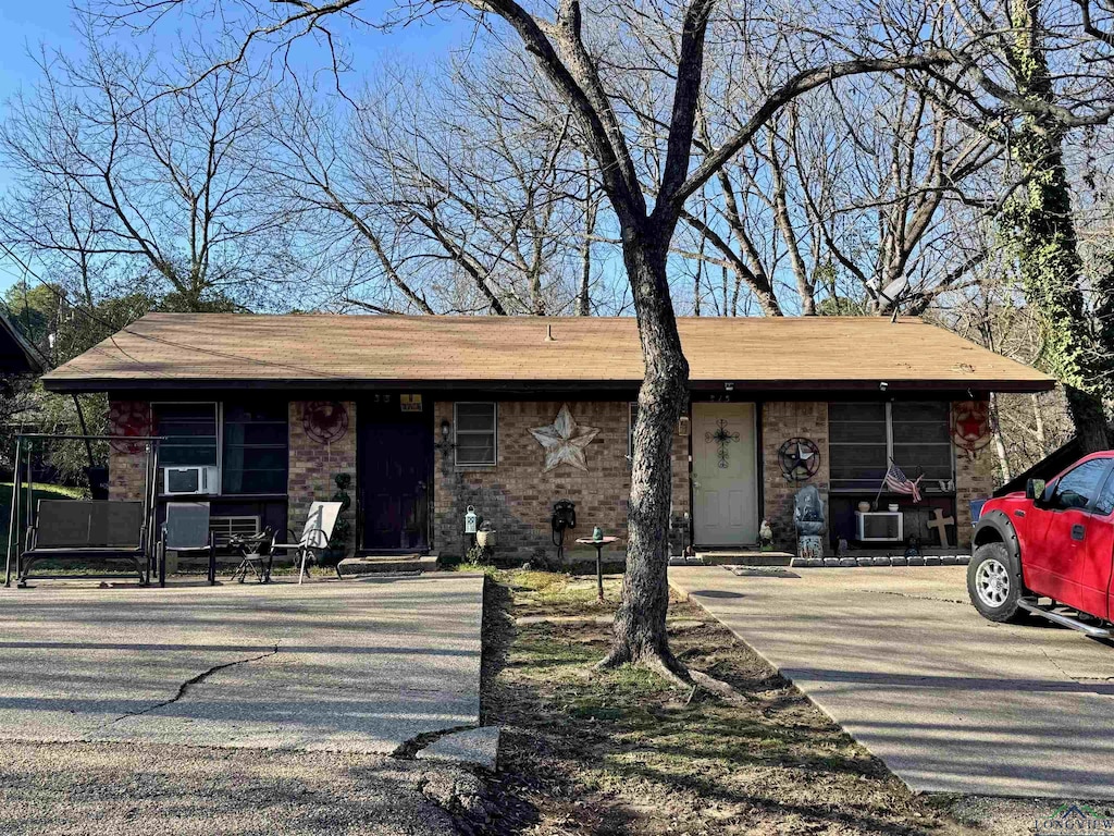 view of front of property featuring cooling unit