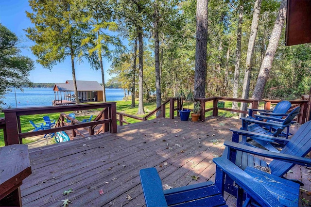 wooden terrace featuring a water view