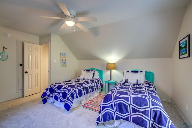 carpeted bedroom featuring lofted ceiling, baseboards, and a ceiling fan