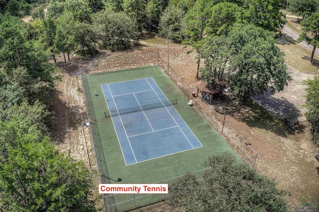 view of tennis court with fence