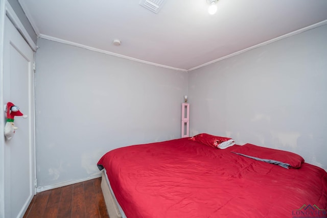 204 E Avalon Ave, Longview, TX 75602 - bedroom with ornamental molding, visible vents, baseboards, and wood finished floors
