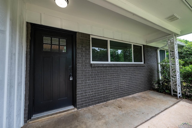 1005 Coushatta Trl, Longview, TX 75605 - doorway to property with a porch and brick siding