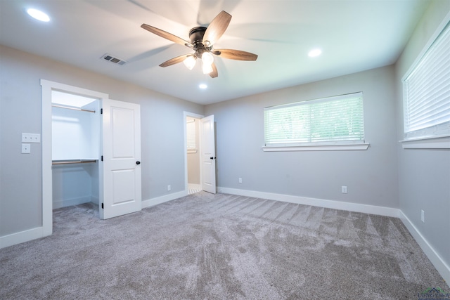 1005 Coushatta Trl, Longview, TX 75605 - unfurnished bedroom with carpet floors, recessed lighting, a ceiling fan, a spacious closet, and baseboards