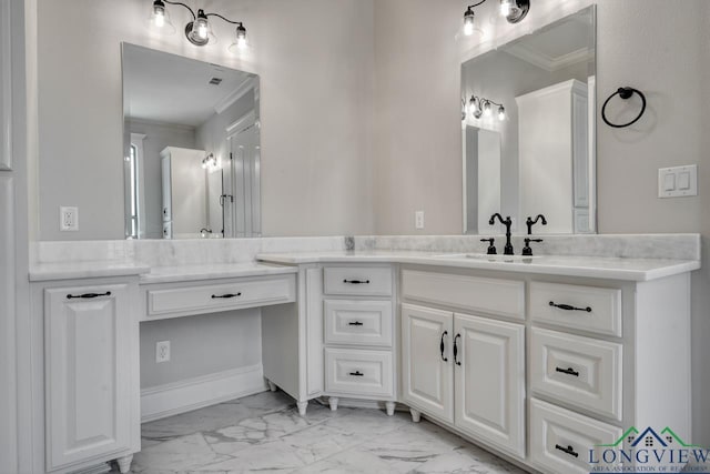 bathroom with ornamental molding and vanity