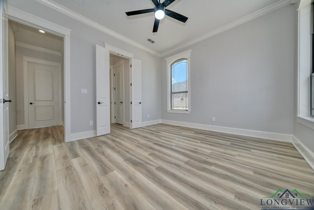 unfurnished bedroom featuring ornamental molding, ceiling fan, and light wood-type flooring