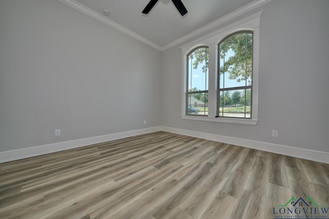 empty room featuring crown molding, ceiling fan, and light hardwood / wood-style flooring