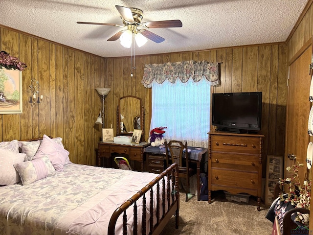 906 Misty Ln, Atlanta, TX 75551 - carpeted bedroom featuring a textured ceiling, wooden walls, and ceiling fan