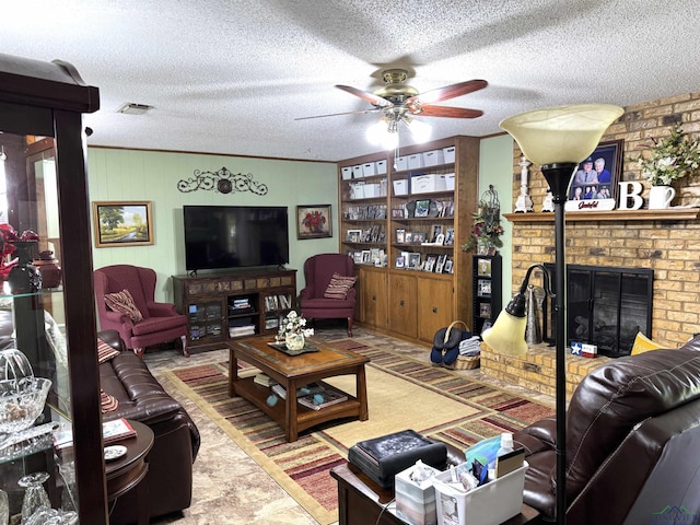 906 Misty Ln, Atlanta, TX 75551 - living room with a ceiling fan, a textured ceiling, and a brick fireplace
